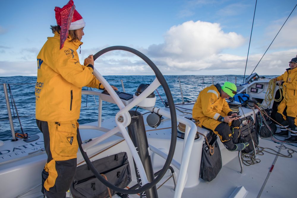 Leg 3, Cape Town to Melbourne, day 16, on board Turn the Tide on Plastic. Francesca watching videos of her faily wishing her a erry christmas while Liz is driving to Melbourne. Photo by Jeremie Lecaudey/Volvo Ocean Race. 24 December, 2017.